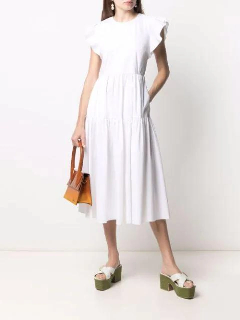 Farfetch's Post | Wearing: Red Valentino Redvalentino Ruffled Midi Dress In White; Jacquemus Les Sandales Tatanes Leather Platform Mules In Green