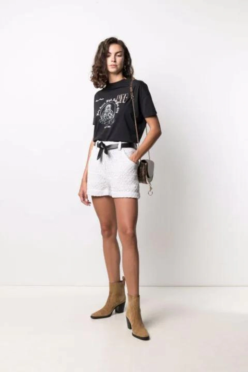 Farfetch's Post | Wearing: Iro Zelysa Metallic-thread Knit Shorts In White; Heron Preston Printed T-shirt In Black; See By Chloé Brown Mara Snake Print Leather Cross Body Bag