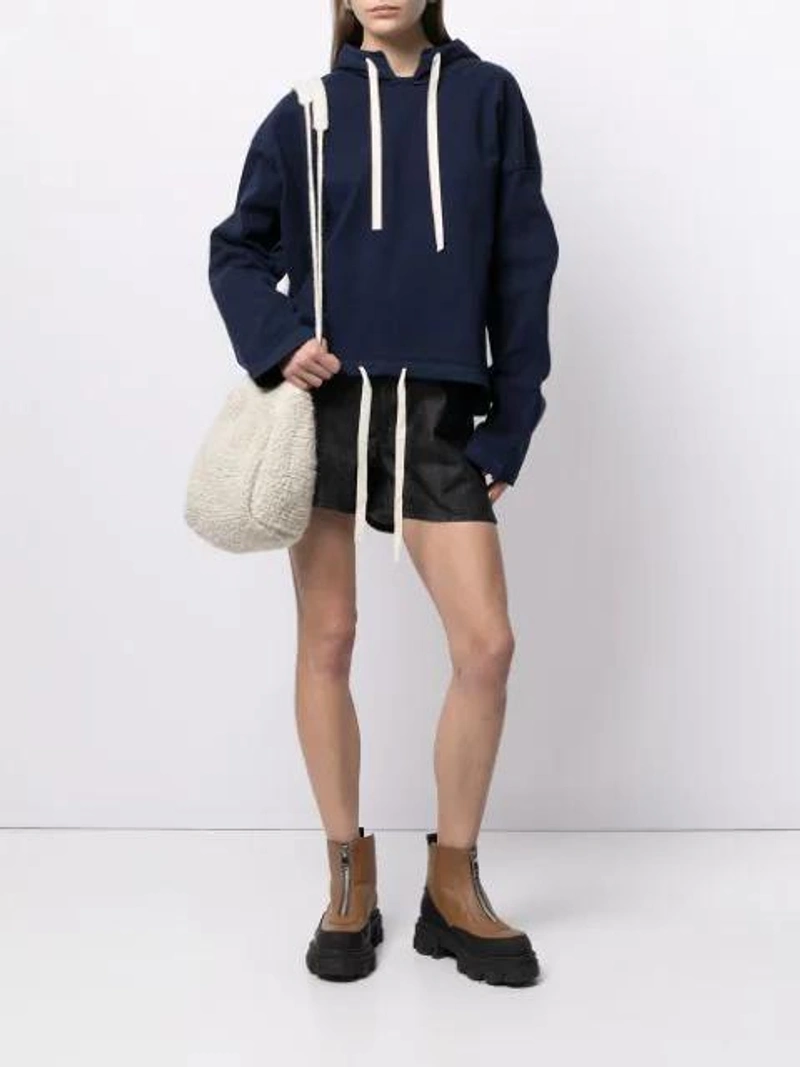 Farfetch's Post | Wearing: Jil Sander Drawstring-hem Cotton-jersey Hooded Sweatshirt In Blue; Jil Sander Wide-leg Selvedge-denim Shorts In Dark Blue; Jil Sander White Knitted Bucket Bag