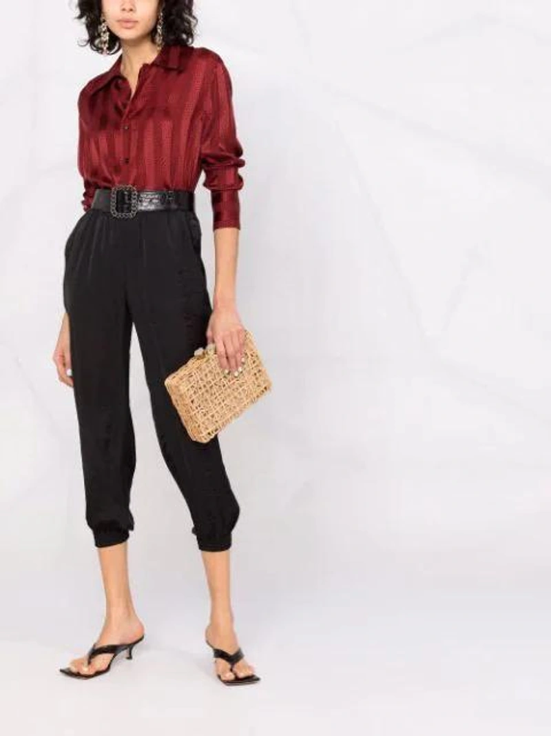 Farfetch's Post | Wearing: Blanca Vita Elasticated Cropped-leg Trousers In Black; Saint Laurent Brick Stripe-print Shirt In Pink,black; Aranaz Chain-trimmed Woven Straw Bag In Neutrals
