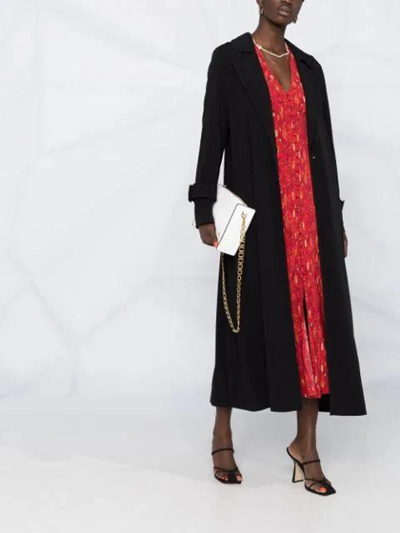 Farfetch's Post | Wearing: Twinset Belted Trench Coat In 00006 Black; Rixo London Katie Printed Crepe Midi Dress In Red; Manu Atelier Chain-trim Leather Cross-body Bag In White