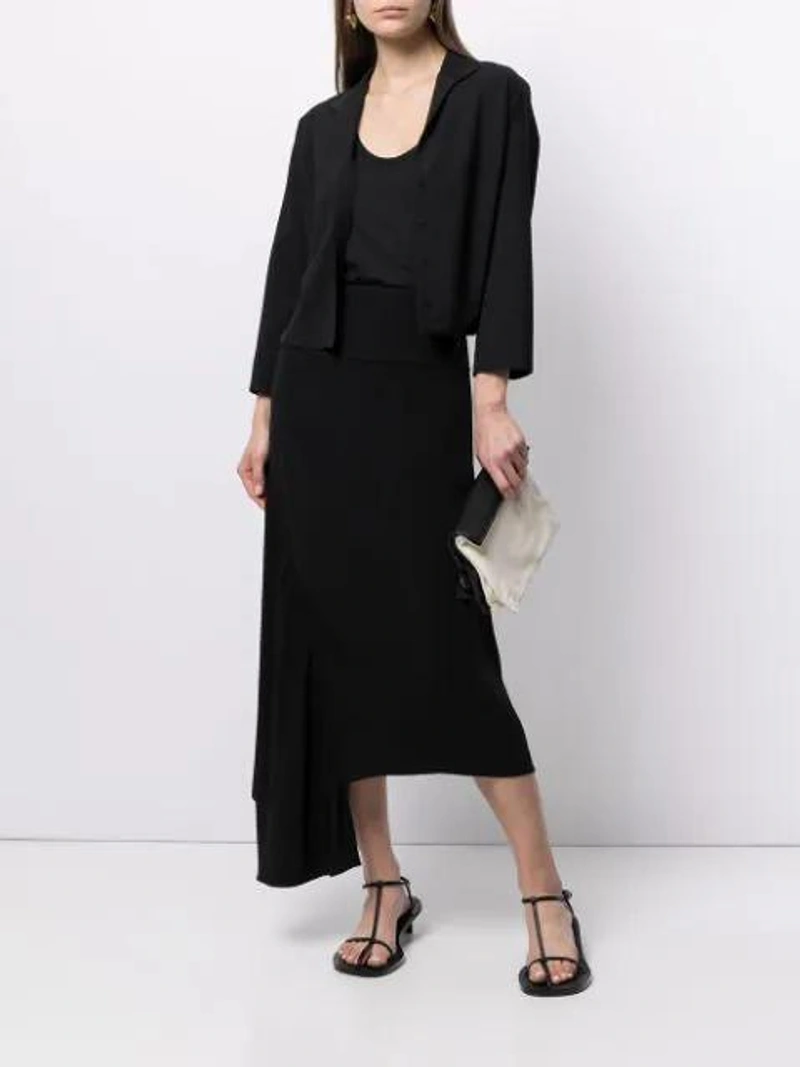 Farfetch's Post | Wearing: Jil Sander Round-neck Sleeveless Top In Black; Jil Sander V-neck Belted Shirt In Black; Jil Sander Black And White Two Tone Fold Over Leather Clutch Bag In Black/white