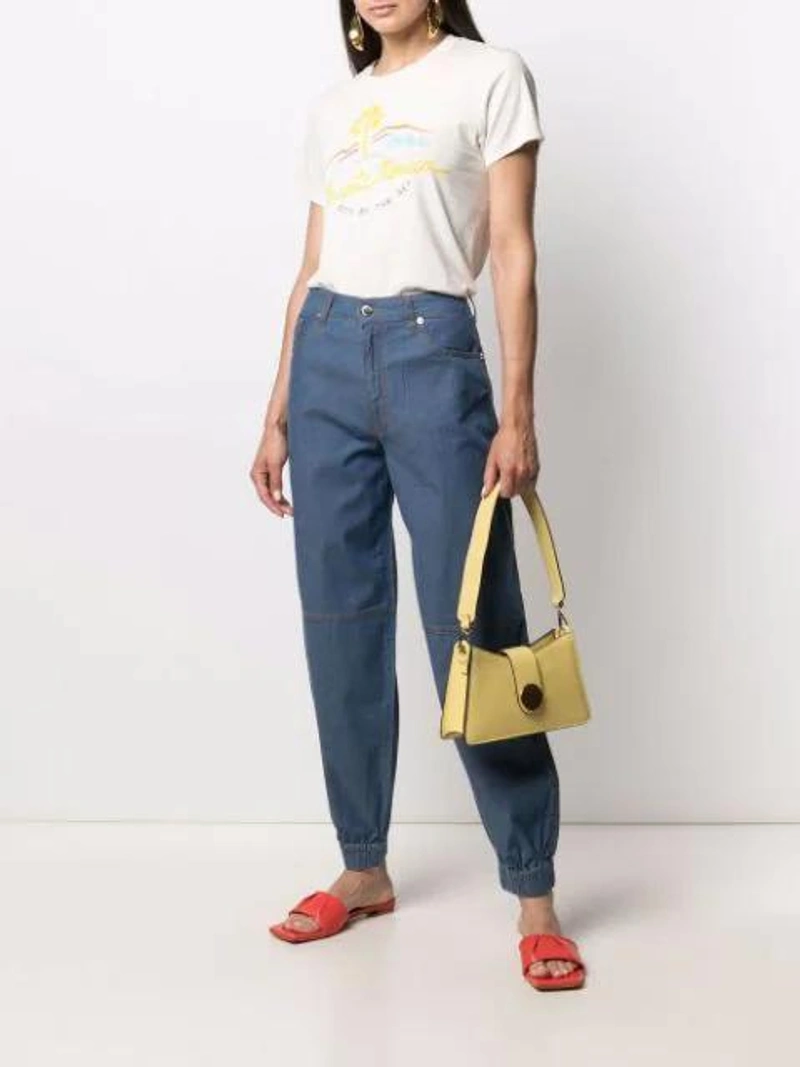 Farfetch's Post | Wearing: Love Moschino Straight-leg Cotton Trousers In Blue; Re/done 70s Printed Cotton-jersey T-shirt In Ivory; Salondeju Orange Volure Leather Sandals