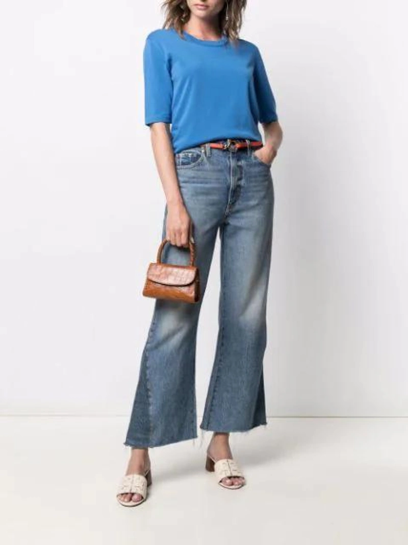 Farfetch's Post | Wearing: Drumohr Short-sleeved Cotton T-shirt In Blue; Khaite Layla Cropped-leg Flared Jeans In Blue; Chloé Orange C Buckle Leather Belt