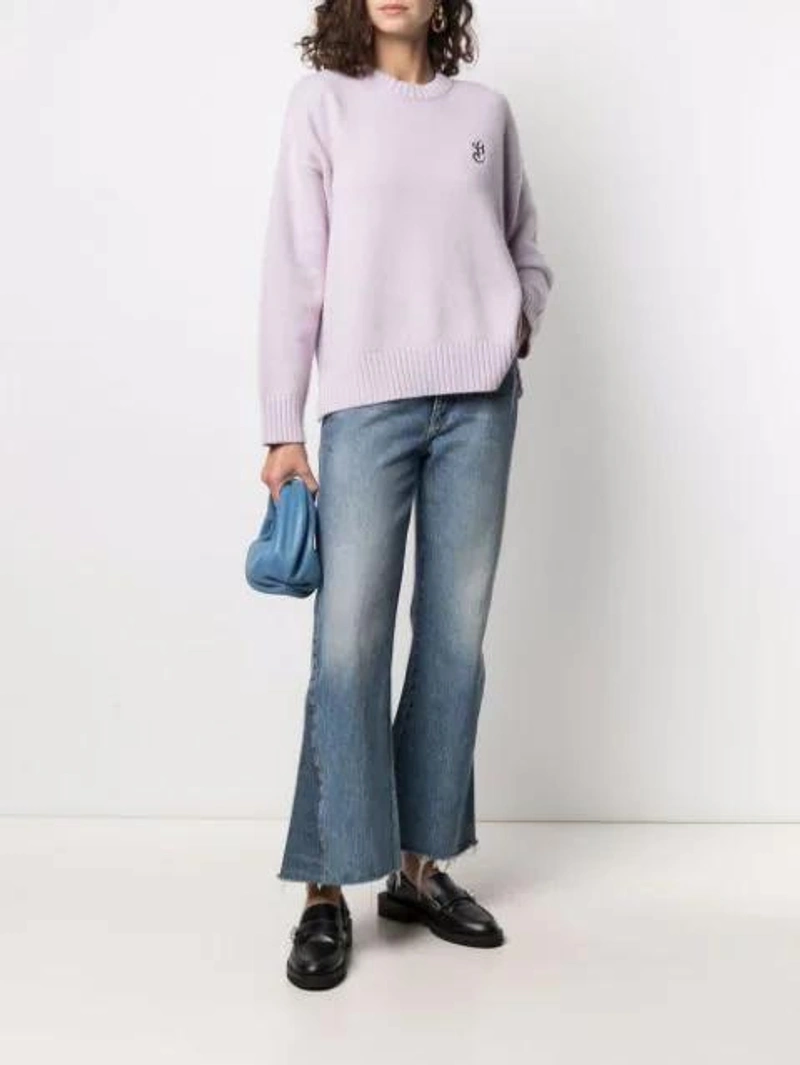 Farfetch's Post | Wearing: Ganni Embroidered Wool And Cashmere-blend Sweater In Orchid Bloom; Khaite Layla Cropped-leg Flared Jeans In Blue; Danse Lente Lola Leather Mini Hobo Bag In Blue