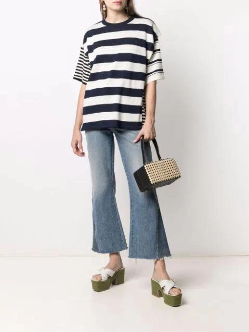 Farfetch's Post | Wearing: Maison Kitsuné Wollen Striped T-shirt In White; Khaite Layla Cropped-leg Flared Jeans In Blue; By Alona Silver-plated Diana Crystal-embellished Earrings