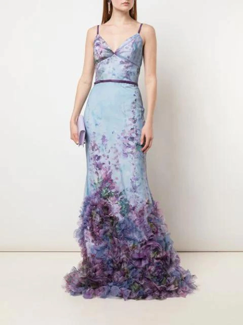 Farfetch's Post | Wearing: Marchesa Notte Sleeveless V-neck Printed Textured Gown In Light Blue; Jacquemus Le Sac Riviera Leather Shoulder Bag In Purple; Anton Heunis Swarovski Crystal Fringe Earrings In Multicolour