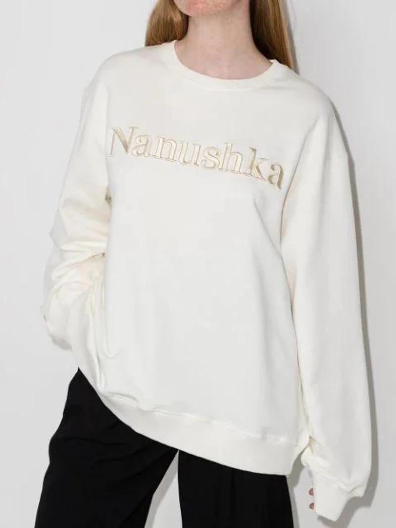 Farfetch's Post | Wearing: Nanushka Remy Logo-embroidered Organic Cotton-jersey Sweatshirt In Off White; Low Classic Crop-leg Tailored Culottes In Black; Bottega Veneta The Chain Pouch Shoulder Bag In Green