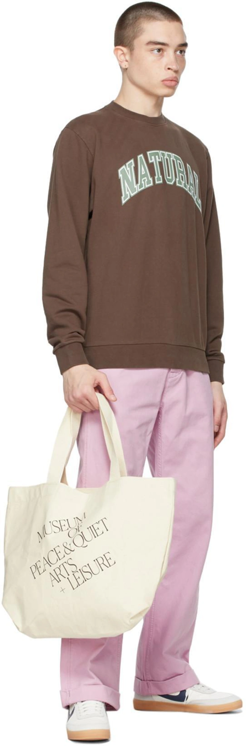 SSENSE's Post | Wearing: Museum Of Peace And Quiet Brown 'natural' Sweatshirt; Levi's Pink '20s Chino Trousers In Mauve Mist; Museum Of Peace And Quiet Off-white 'arts + Leisure' Tote In Natural