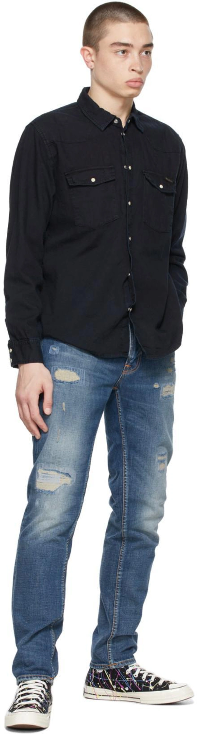 SSENSE's Post | Wearing: Nudie Jeans Black Denim Organic George Shirt In Navy; Nudie Jeans Blue Gritty Jackson Jeans In Indigo Gala; Converse Chuck 70 Archive Paint Splatter Print High-top Sneakers In Black