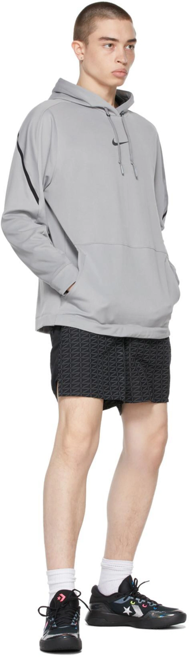 SSENSE's Post | 搭配: Nike Grey & Black Pro Pullover Hoodie In Particle Grey,black；Nike Black Run Logo Shorts In Black/white；Converse Black G4 Low Sneakers In Iridescent
