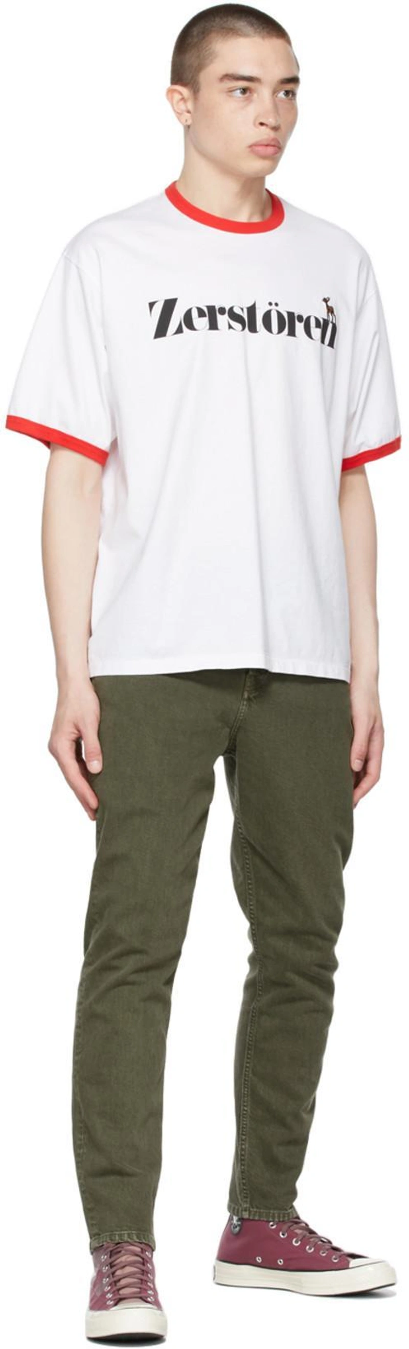 SSENSE's Post | Wearing: Undercover White 'zerstören' Print T-shirt; Helmut Lang Men's High-rise Jeans With Straps In Birch Green Stone; Converse Purple Plant Color Chuck 70 Sneakers In Rose Taupe/egret/bla