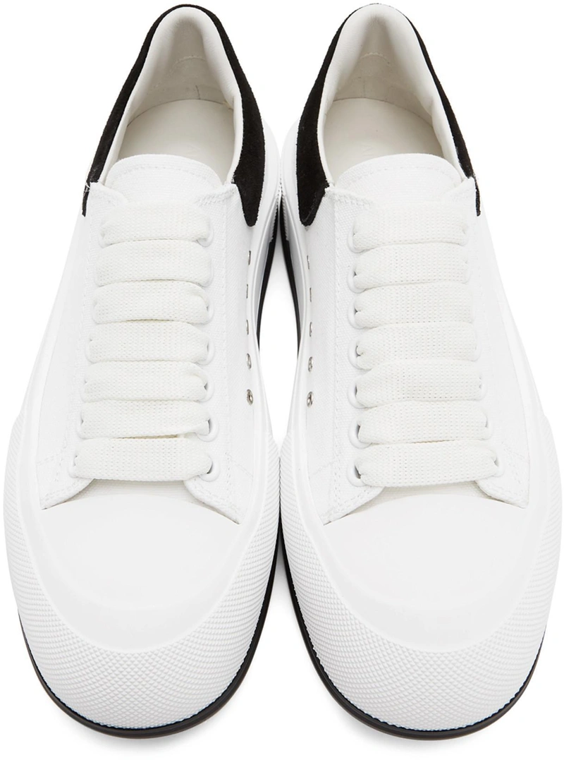 SSENSE's Post | Wearing: Alexander Mcqueen Deck Lace-up Plimsoll Sneakers In White; Alexander Mcqueen White Cotton Trousers In 9000 White; Alexander Mcqueen Cotton Sweatshirt With Logo Patch Application In White