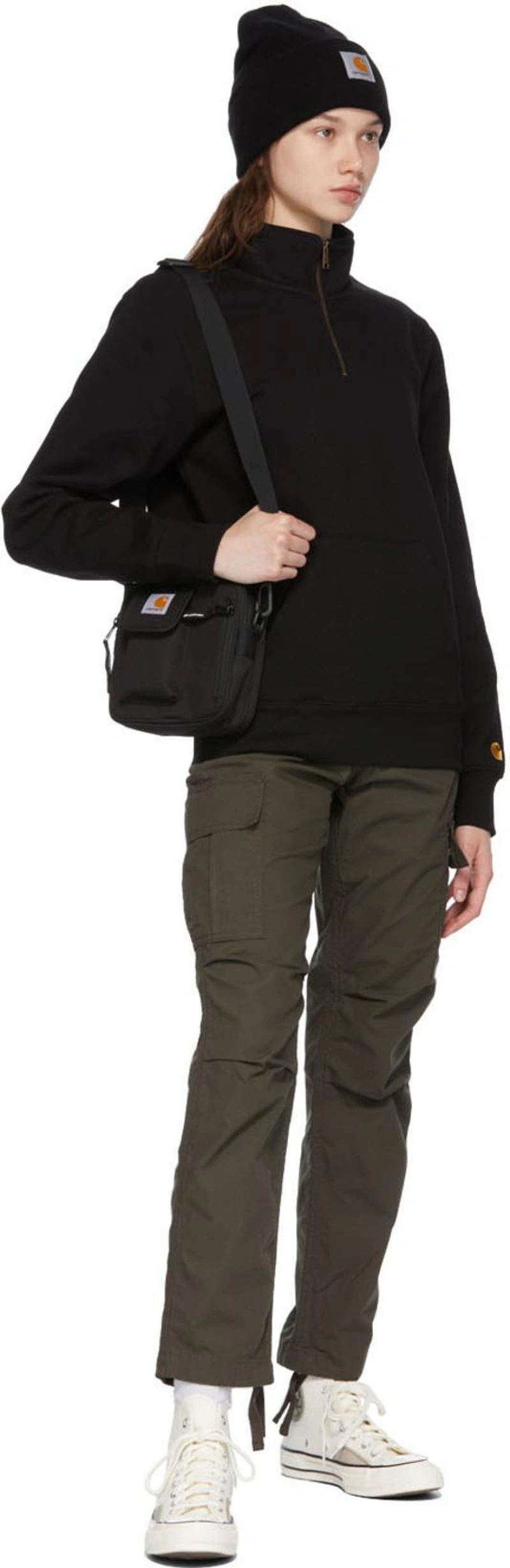 SSENSE's Post | Wearing: Carhartt Khaki Cymbal Trousers In Cypress Rin; Carhartt Black Chase Sweatshirt In Black/gold; Carhartt Black Small Essentials Bag