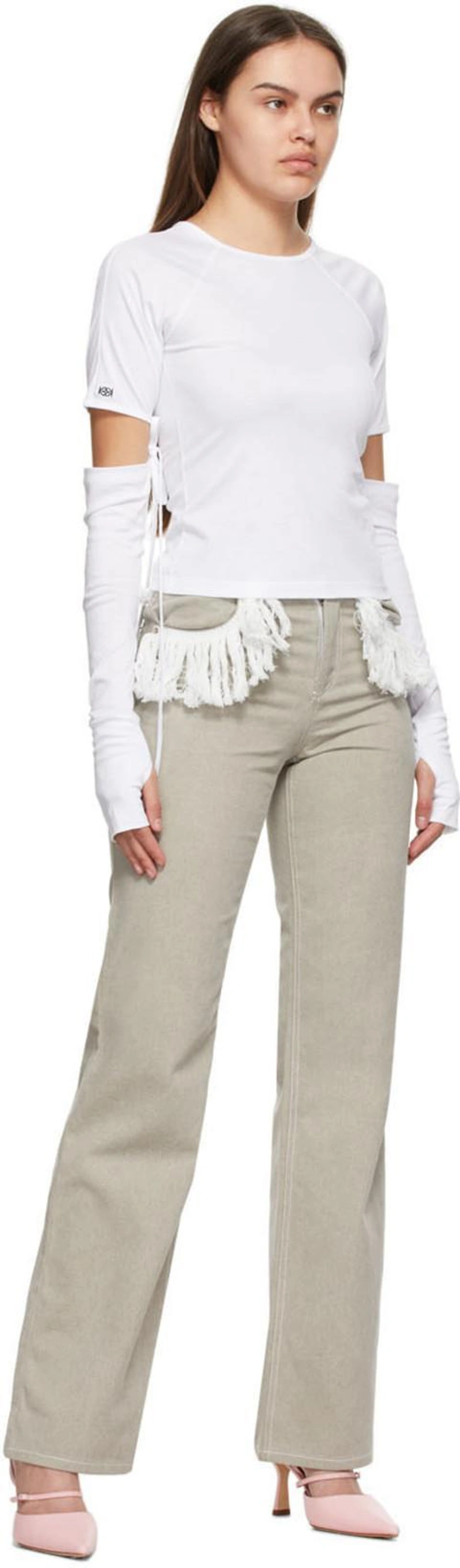SSENSE's Post | Wearing: Kijun White Tosi T-shirt; Kijun Grey Fringe Jeans; By Far Pink Nappa Tiffany Slingback Heels