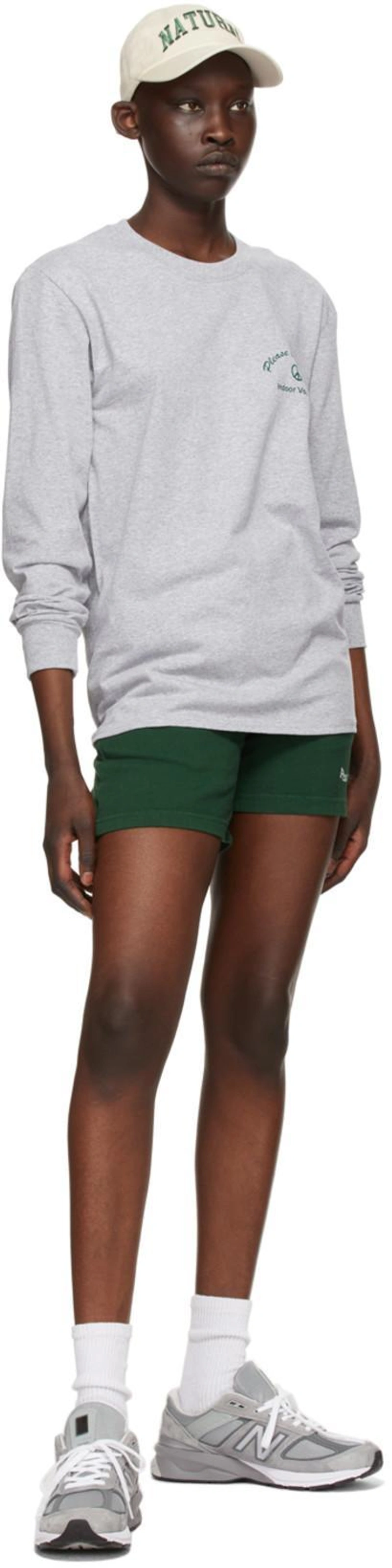 SSENSE's Post | Wearing: Museum Of Peace And Quiet Ssense Exclusive Grey Cotton 'indoor Voices' Long Sleeve T-shirt In Heather; Museum Of Peace And Quiet Ssense Exclusive Green Word Mark Gym Shorts In Forest; Museum Of Peace And Quiet Ssense Exclusive Off-white Natural Cap In Bone