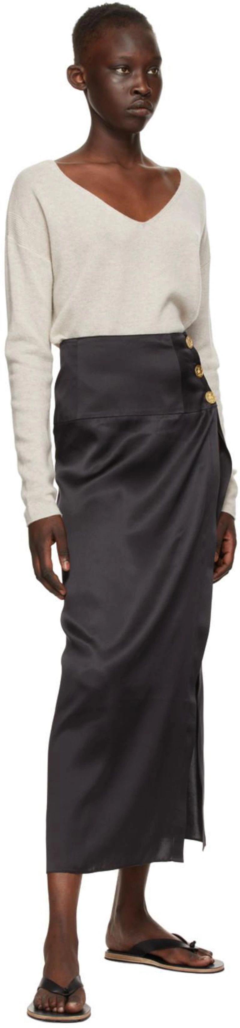 SSENSE's Post | Wearing: Le Kasha Black Silk Coin Tacheng Skirt; Le Kasha Beige Cashmere Tibet Sweater In Light Beige; Jil Sander Stud-embellished Leather Flip Flops In 001 Black