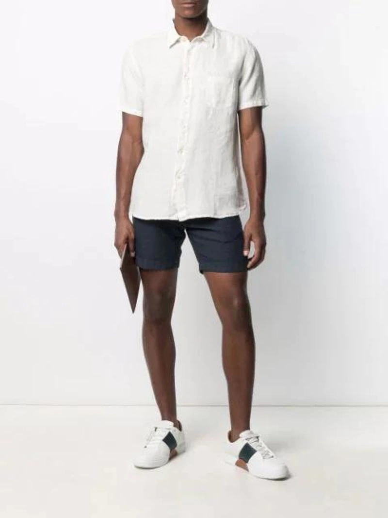 Farfetch's Post | Wearing: 120% Lino Linen Slim-leg Shorts In Blue; 120% Lino Plain Button-down Shirt In White; Loewe Logo Clutch Bag In Brown