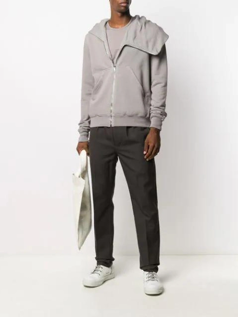 Farfetch's Post | Wearing: Rick Owens Asymmetric Zipped Hoodie In Grey; Rick Owens Drawstring Straight-leg Trousers In Brown; Rick Owens Long-sleeve Knit Top In Grey