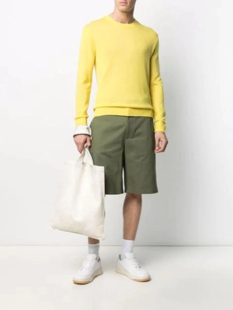 Farfetch's Post | Wearing: Jil Sander Knitted Long-sleeve Jumper In Yellow; Jil Sander Embroidered-design Knee-length Shorts In Green; Rick Owens Shopper Im Used-look In White
