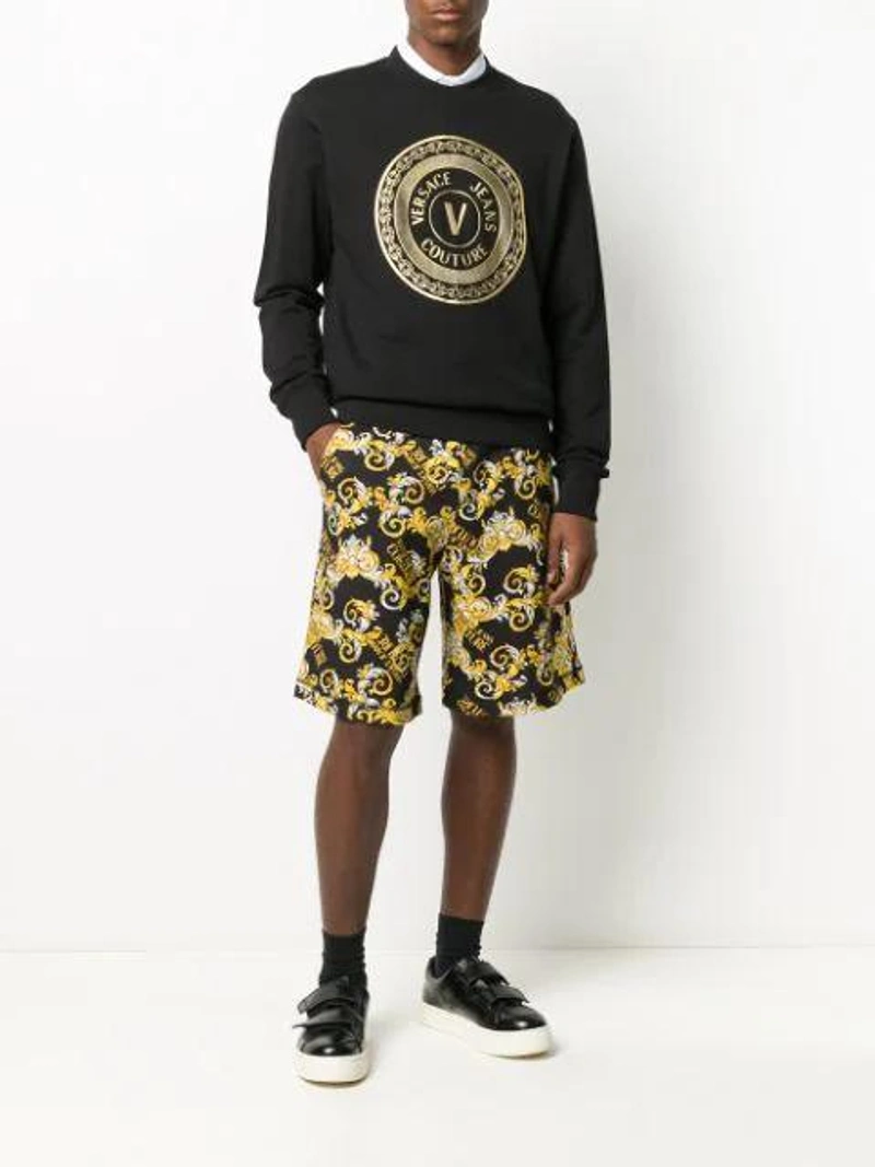 Farfetch's Post | Wearing: Versace Jeans Couture Baroque-print Logo Track Shorts In Black; Versace Jeans Couture Logo Front Print Sweatshirt In Black; Versace Jeans Couture Logo-print Short-sleeved Polo Shirt In White