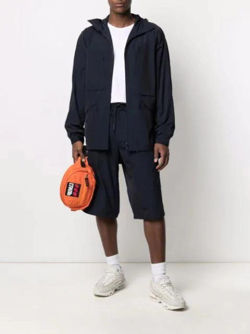 Farfetch's Post | Wearing: Comme Des Garçons Shirt White Cotton Forever T-shirt; Y-3 Light Ripstop Hooded Windbreaker In Blue; Y-3 Drawstring Waist Knee-length Shorts In Blue