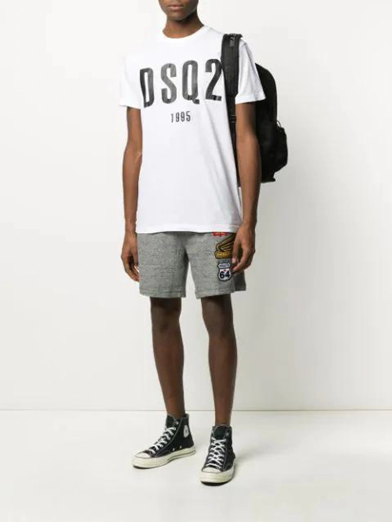 Farfetch's Post | Wearing: Converse 1970s Chuck Taylor All Star Canvas High-top Sneakers In Black/black/gret; Dsquared2 1995 Logo Print T-shirt In White; Dsquared2 Embroidered Logo Patch Track Shorts In Grey