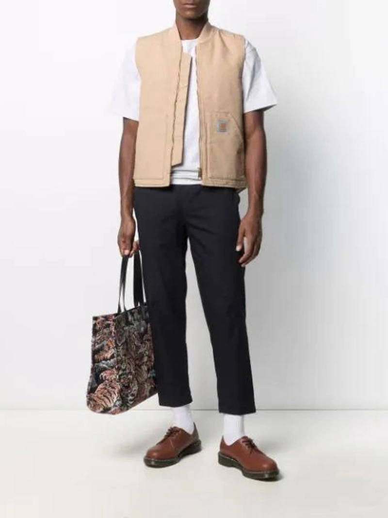 Farfetch's Post | Wearing: Carhartt American Script Embroidered Logo T-shirt In White; Carhartt Ribbed-collar Gilet In Neutrals; Maison Kitsuné 'city' Hose Mit Kordelzug In Blue