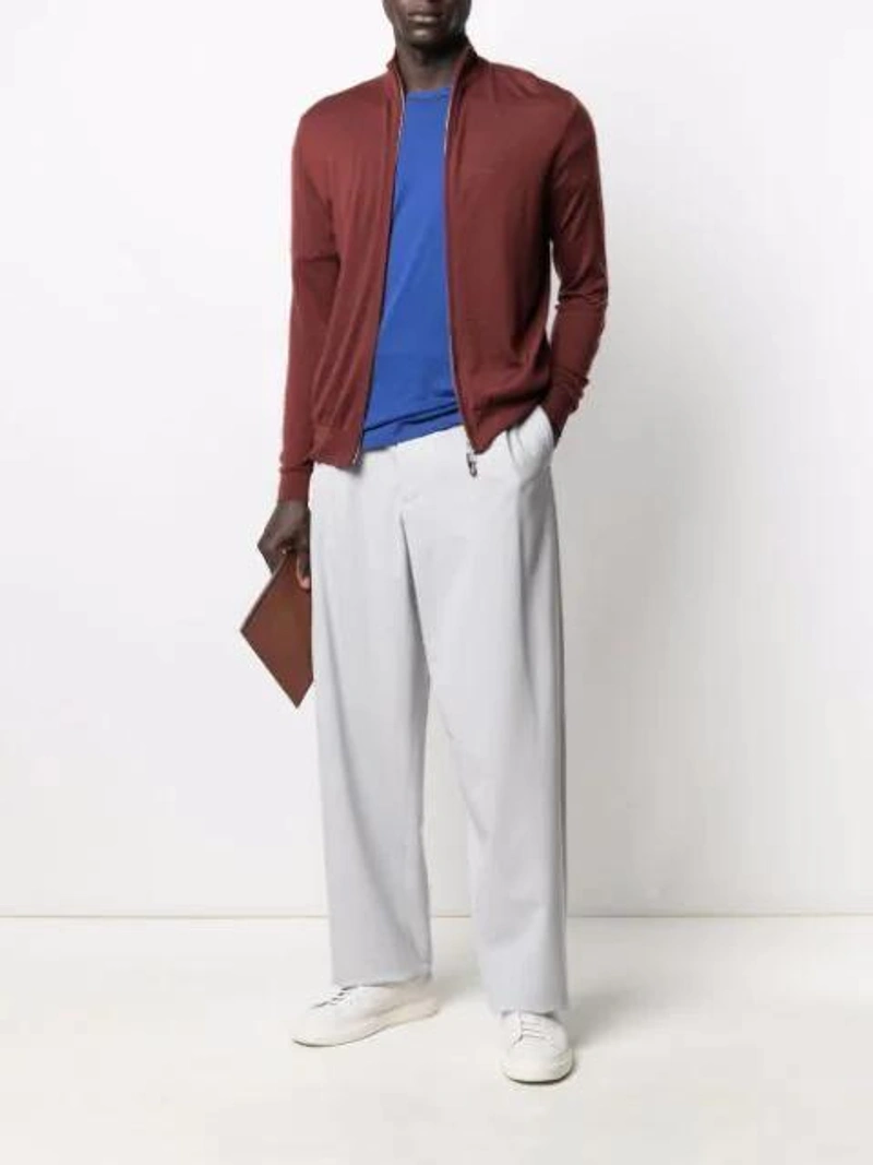 Farfetch's Post | Wearing: N•peal The Hyde Zipped Cardigan In Brown; Z Zegna Contrasting Details Polo Shirt In Electric Blue; Loewe Logo Clutch Bag In Brown