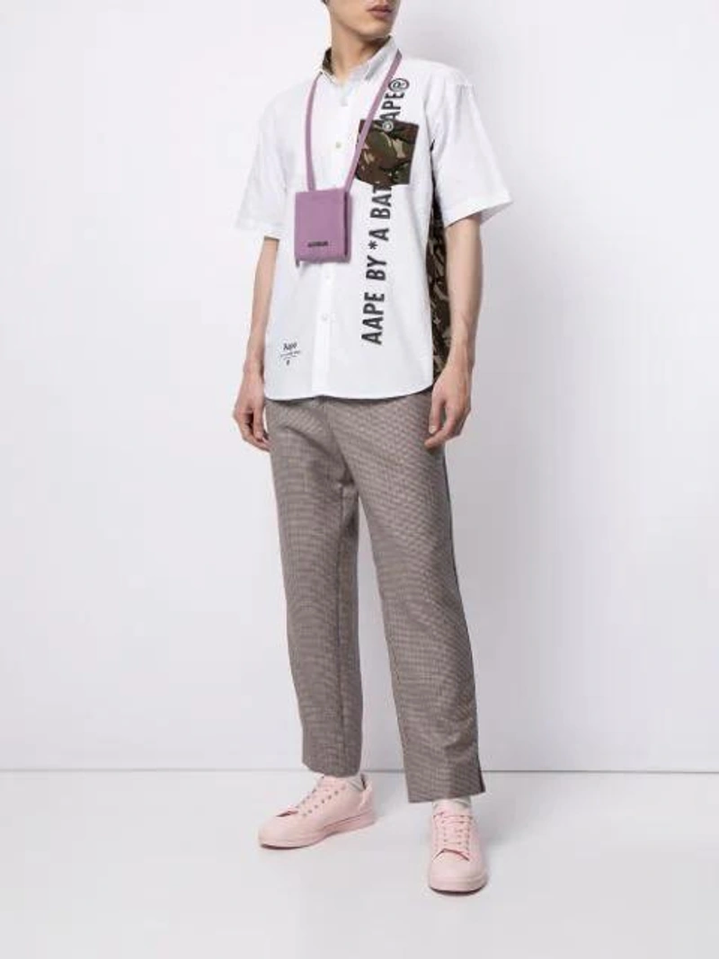 Farfetch's Post | Wearing: Aape By A Bathing Ape Logo-print Short-sleeved Shirt In White; Gucci Men's Check Wool-mohair Drawstring Trousers In Neutral; Jacquemus Purple Le Gadjo Pouch Shoulder Bag In Pink