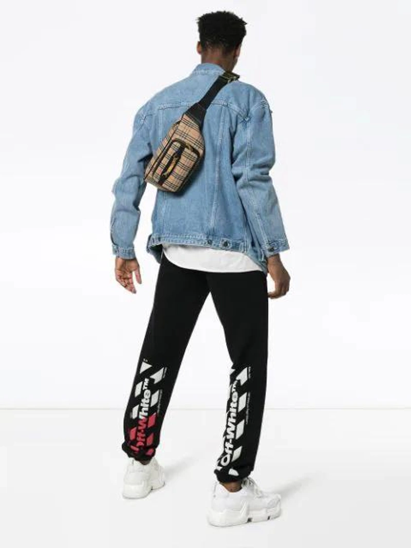 Farfetch's Post | Wearing: Off-white Logo Sweatpants In Black; Y/project Y / Project Reconstructed Denim Jacket In Blue; Ksubi New Order Graphic Print T In White