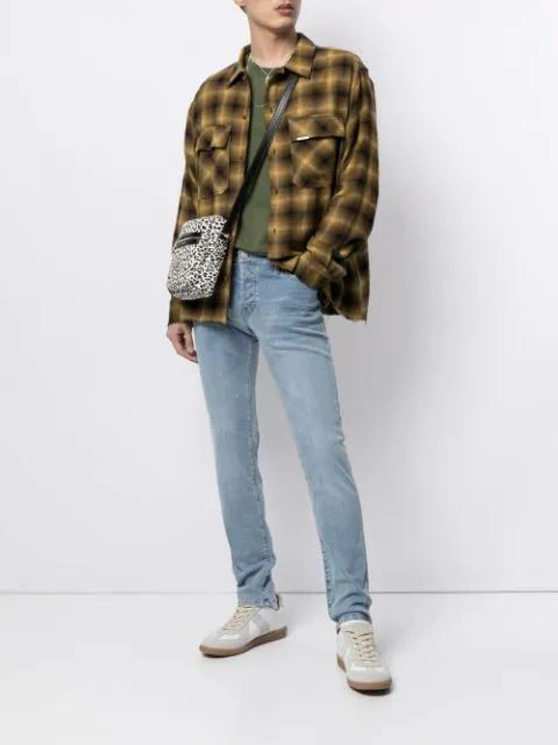 Farfetch's Post | Wearing: Maison Margiela Masion Margiela Replica Sneakers In White; True Religion Tony Faded Slim-fit Jeans In Blue; Represent Checked Flannel Shirt In Yellow