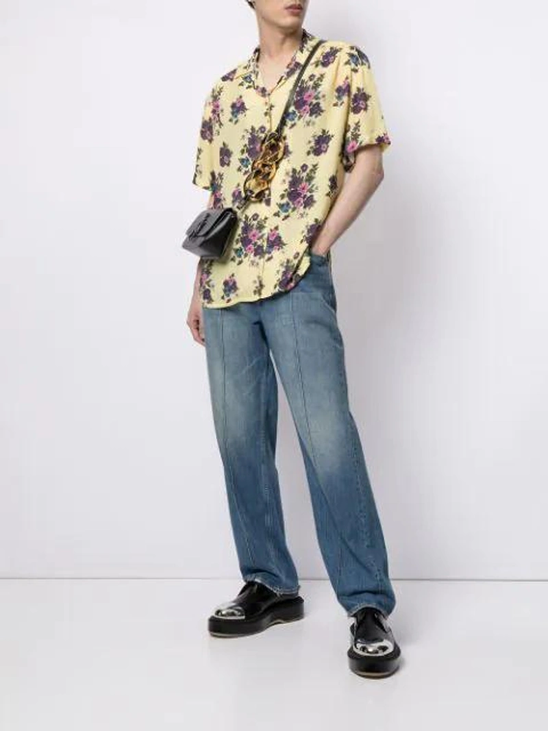 Farfetch's Post | Wearing: Cool Tm Floral Print Shirt In Yellow; Our Legacy Formal Cut Crease Jeans In Blue; Jw Anderson Black Nano Anchor Leather Cross Body Bag