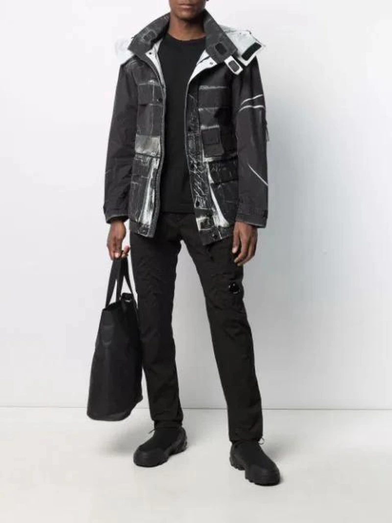 Farfetch's Post | Wearing: C.p. Company Cracked-effect Jacket In Black; C.p. Company Tapered-leg Cargo Trousers In Black