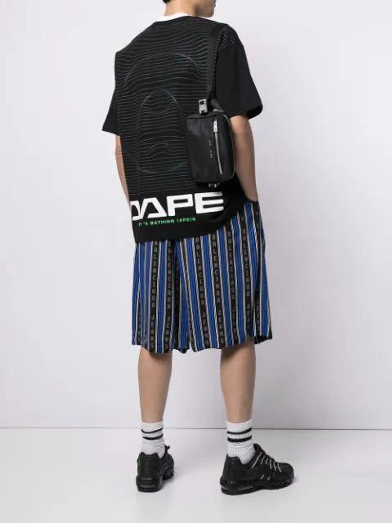 Farfetch's Post | Wearing: Aape By A Bathing Ape Logo-print Short-sleeved T-shirt In Black; Off-white Reverse Logo Sport Socks; Alyx Fuoripsta Logo-lettering Belt Bag In Black