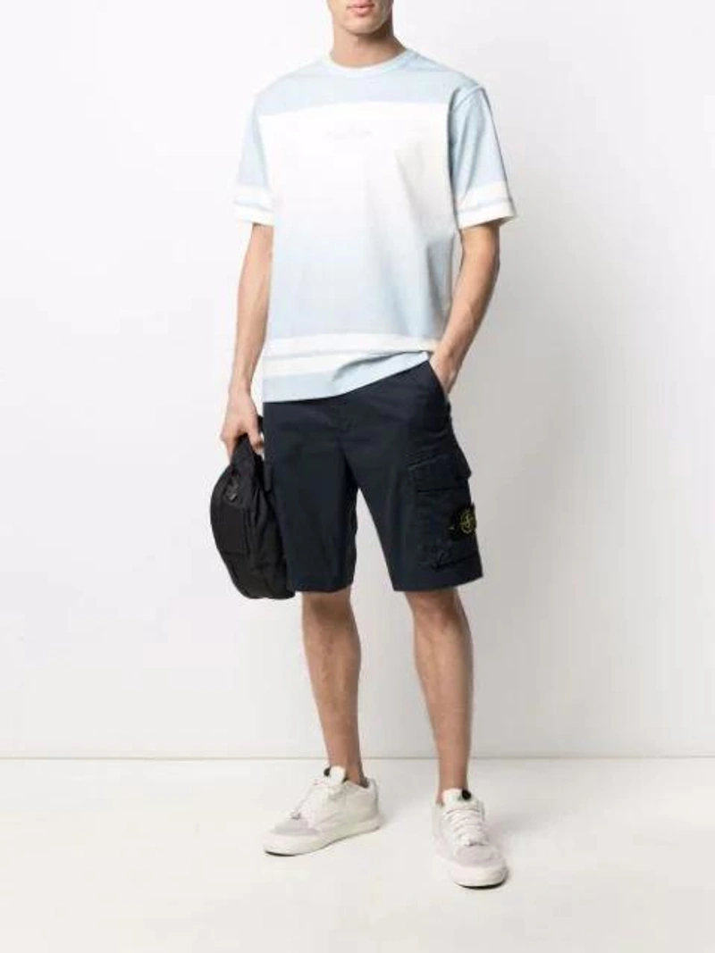Farfetch's Post | Wearing: Stone Island Embroidered-logo Cotton Cargo Shorts In Black; Off-white Arrow Graphic Sports Socks In White; Stone Island Logo-print Short-sleeve T-shirt In Blue