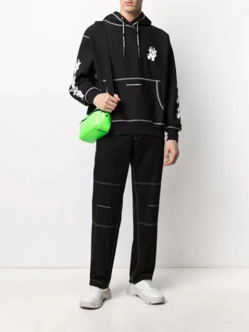 Farfetch's Post | Wearing: United Standard Mask-print Contrast Stitching Hoodie In Black; United Standard Straight Contrast-stitch Trousers In Black; Mulberry Urban Reporter Bag In Green