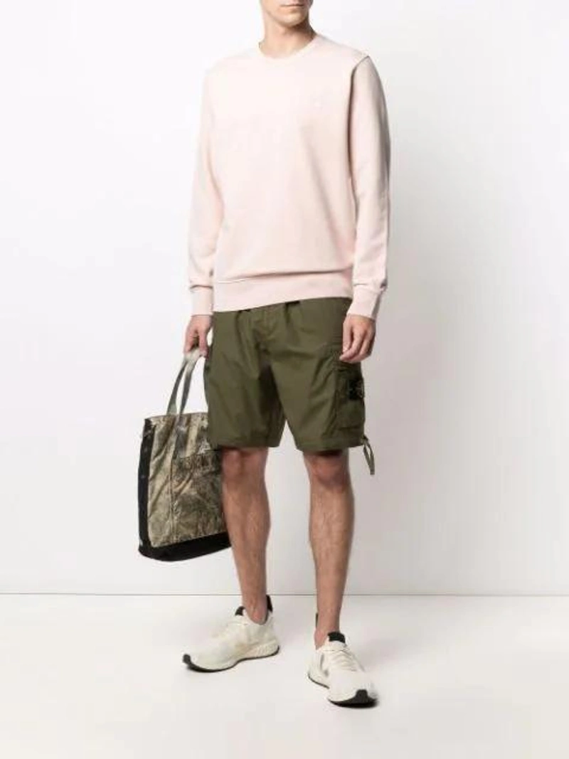 Farfetch's Post | Wearing: Stone Island High-rise Logo-patch Cargo Shorts In Green; Stone Island Crewneck Cotton Sweatshirt In Pink; Stone Island 'burnout' Shopper In Green