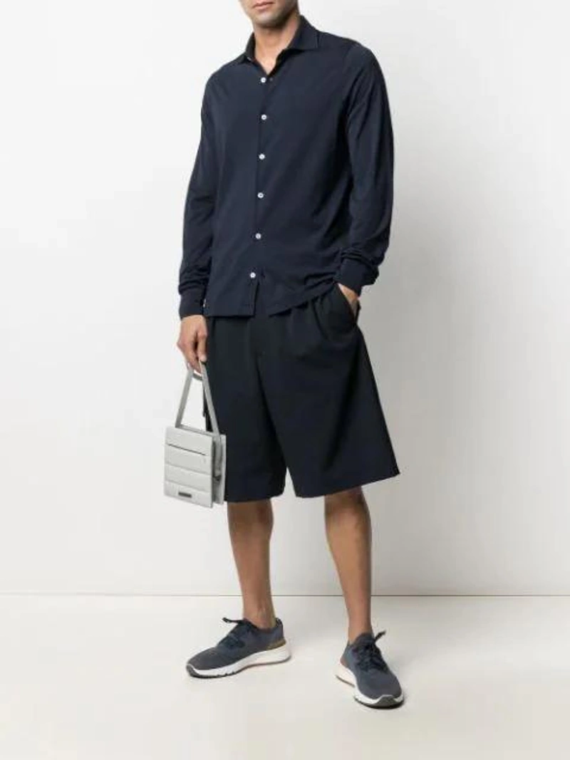 Farfetch's Post | Wearing: Brunello Cucinelli Mesh Knitted Lace Up Trainers In Blue; Mauro Ottaviani Classic Cotton Shirt In Blue; Joseph Techno Wool Shorts In Blue
