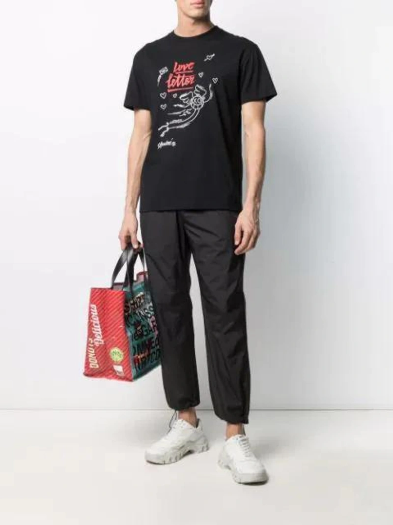 Farfetch's Post | Wearing: Soulland Colin Graphic-print Organic Cotton T-shirt In Black; Comme Des Garçons Shirt Delicious Logo Tote In Purple; Tom Ford Ft0711 Square-frame Sunglasses In White