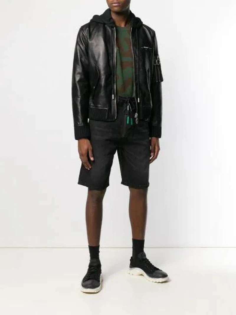 Farfetch's Post | Wearing: Off-white Zip Appliqué Shorts In Black; Off-white Off White Hooded Biker Jacket In Black; Prada Jacquard Triangle Logo Socks In F0002 Black