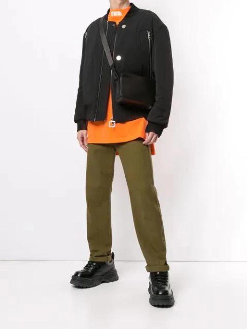 Farfetch's Post | Wearing: Wooyoungmi Black Nylon Bomber Jacket; Heron Preston Embroidered Cotton Jersey Ls Turtleneck In Orange; Off-white Men's Binder Clip Leather Camera Bag In Black