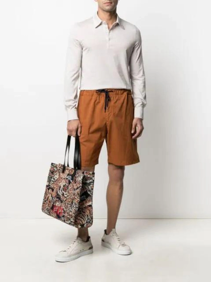 Farfetch's Post | Wearing: Emanuele Bicocchi Curb Braided Bracelet In Silver; Fedeli Striped Polo Shirt In Neutrals; Kenzo Tiger Embroidered Tote Bag In Black