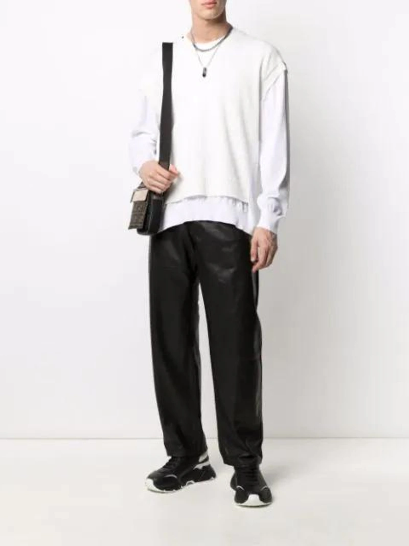 Farfetch's Post | Wearing: Dolce & Gabbana Dolce And Gabbana Black And White Daymaster Sneakers; Dolce & Gabbana Layered Knitted Jumper In White; Trussardi Straight-leg Leather Trousers In Black