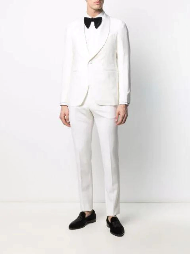 Farfetch's Post | Wearing: Tagliatore Shawl-lapel Two-piece Dinner Suit In White; Comme Des Garçons Shirt Front Pocket Shirt In White; Gucci Pre-tied Cotton-blend Velvet Bow-tie In Black