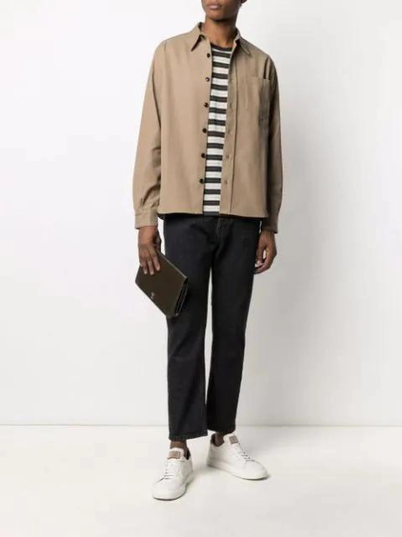 Farfetch's Post | Wearing: Haikure Long-sleeve Chest-pocket Shirt In Green; Saint Laurent Ysl-embroidered Striped Wool T-shirt In White; Haikure California Double Jeans In Blue