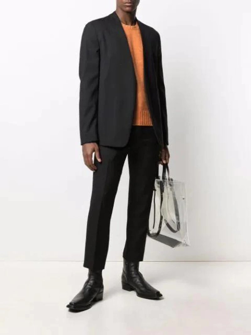 Farfetch's Post | Wearing: Haider Ackermann Pressed-crease Tailored Trousers In Black; Maison Margiela Black Jacket Without Buttons; Prada 'shetland' Pullover Mit Rundem Ausschnitt In Orange