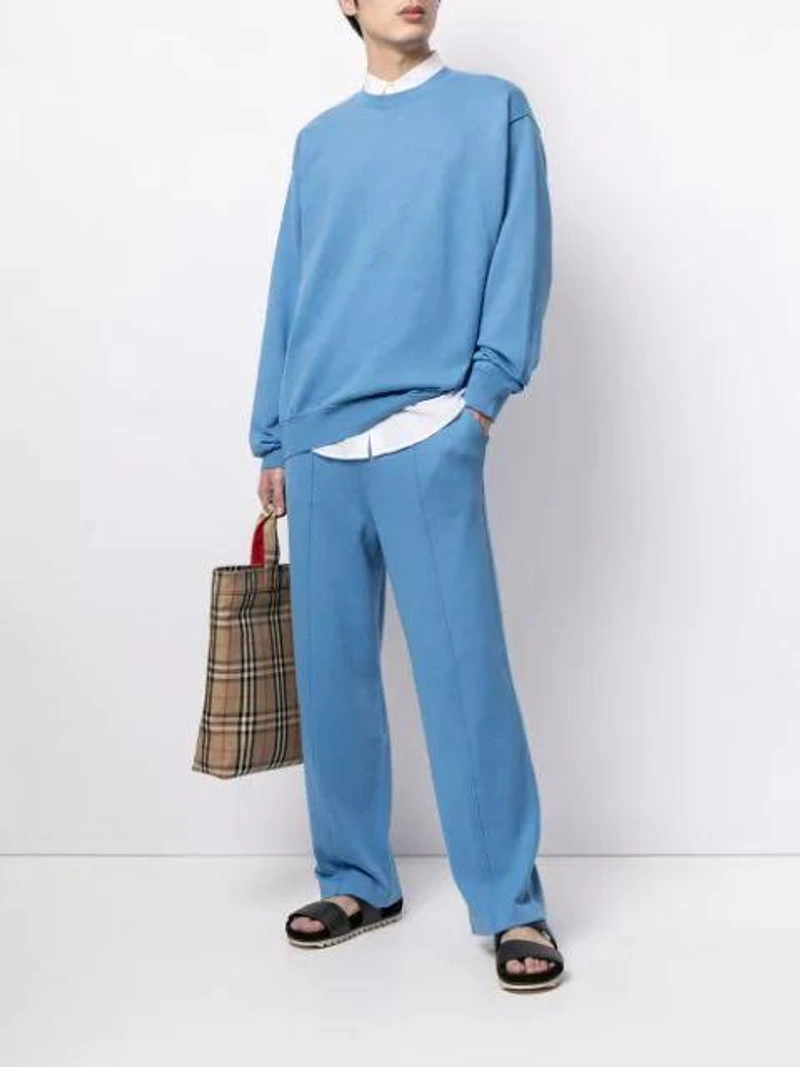 Farfetch's Post | Wearing: Coohem Elasticated-waist Cotton-silk Trousers In Blue; Coohem Crewneck Cotton-silk Sweatshirt In Blue; Burberry Logo Appliqué Vintage Check Cotton Blend Tote In Beige