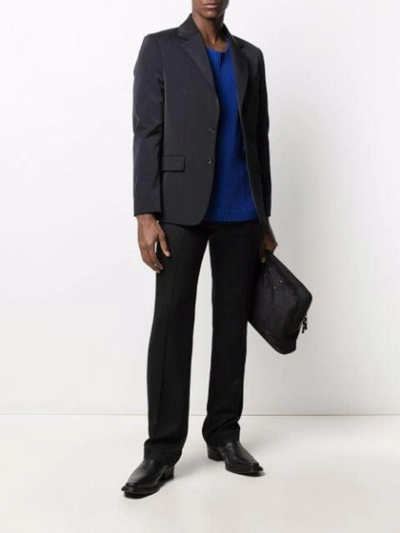 Farfetch's Post | Wearing: Haider Ackermann Pressed-crease Elasticated-waist Trousers In Black; Issey Miyake Pleated Wide-sleeve Top In Blue; Sunflower Single Breasted Blazer In Black