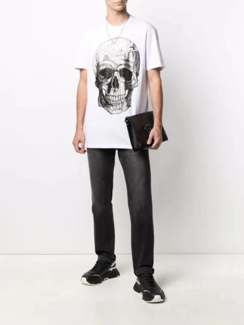 Farfetch's Post | Wearing: Philipp Plein Skull-print T-shirt In White; Dolce & Gabbana Dolce And Gabbana Black And White Daymaster Sneakers; Alexander Mcqueen Silver Textured Twin Skull Bracelet